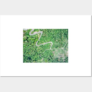 Aerial view of curvy mountain road through a jungle Posters and Art